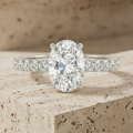 The Timeless Oval-Cut Solitaire Engagement Ring with Pave Band