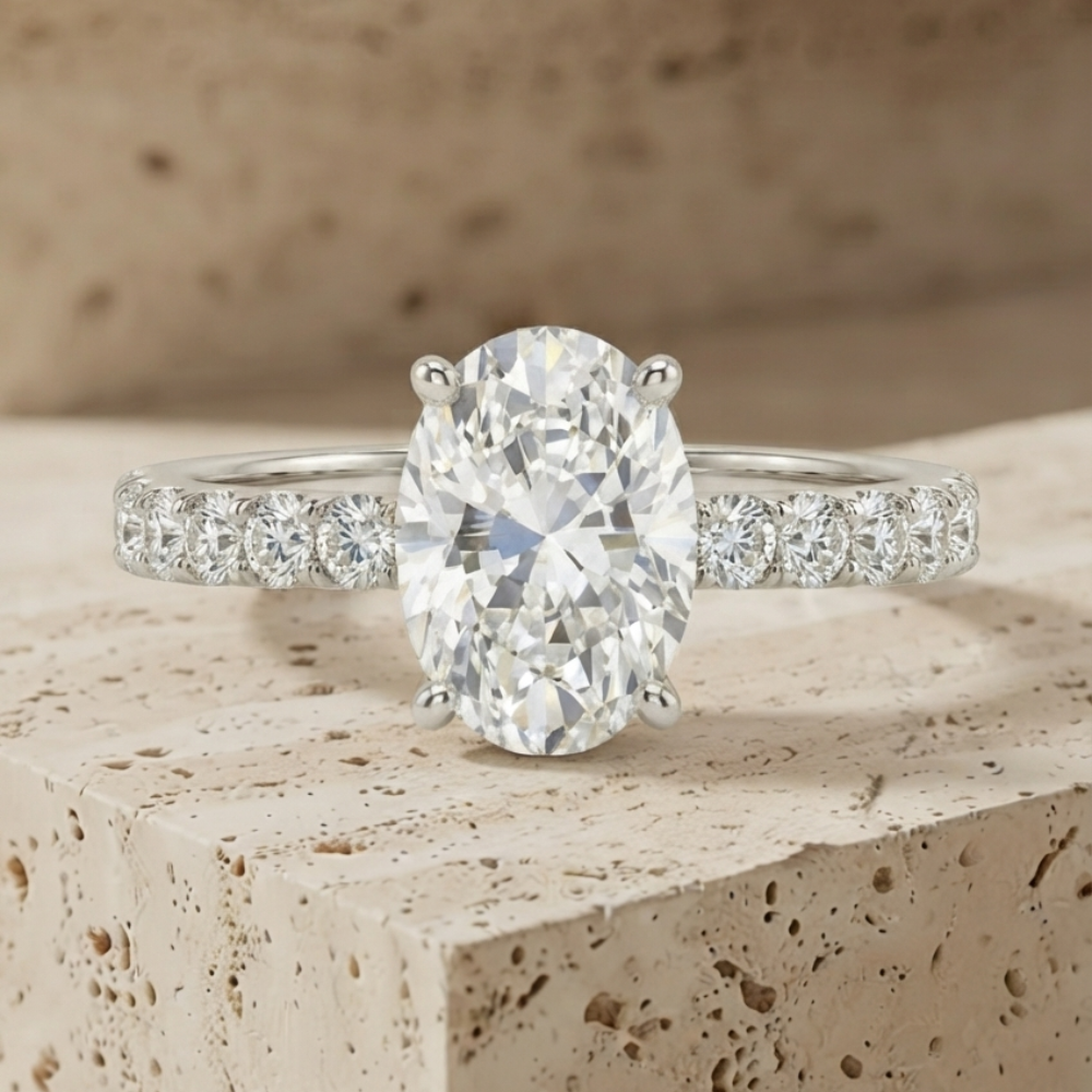 The Timeless Oval-Cut Solitaire Engagement Ring with Pave Band